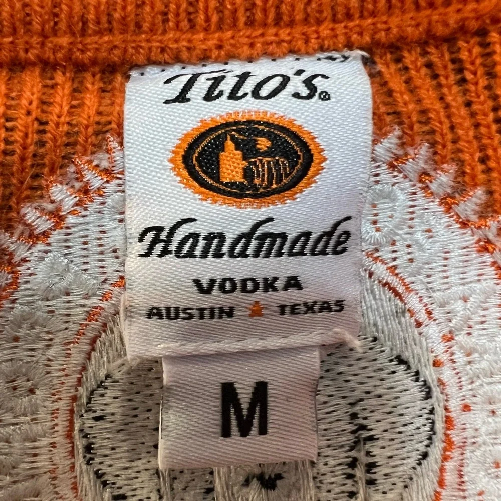 Tito's Festive Christmas Sweater with Black &‎ Orange Accents. Size Medium.